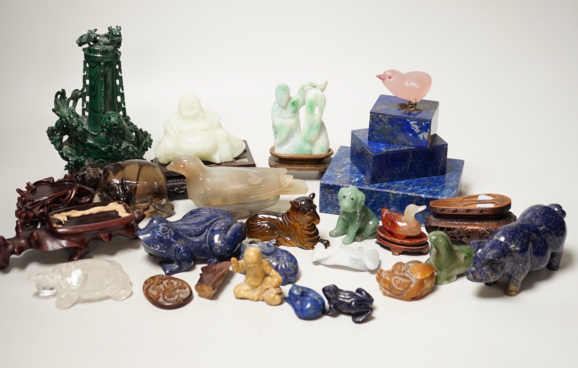 A collection of assorted Chinese hardstone carvings, boxes etc, including a Chinese jadeite carving of a lady, 7.8cm high, wood stand